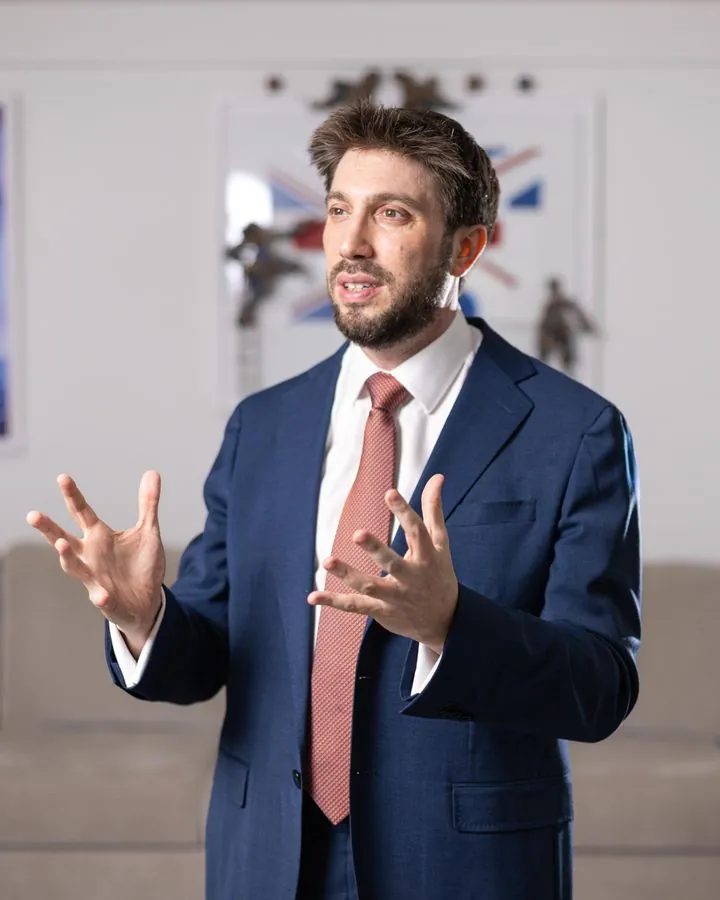 Daniel Seal speaking in a navy suit